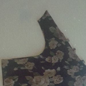 A dress up shirt with Rose's on it.